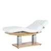 Table esthétique chauffante CALYA en PU blanc avec 4 moteurs électriques et design ergonomique.